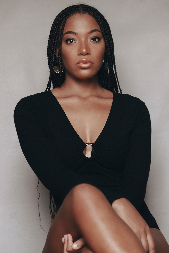 Portrait of Girl in Braids and Black Dress